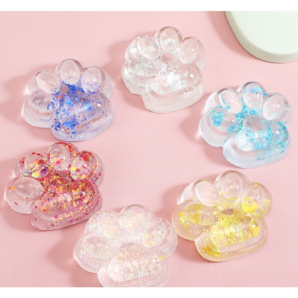 Jucarie Antistres Squishy, Flippy, cu Revenire Lenta, Squeeze Pinch Family, Model Cat Paw, 6.5 x 7 cm, din Tpr, 4-6 Ani, Model 4 Sclipici, Transparent